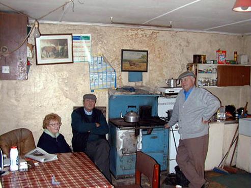 Maura Harte Bradfield, Michael John and Tommy Bradfield in kitchen of Bradfield farm.jpg 72.6K
